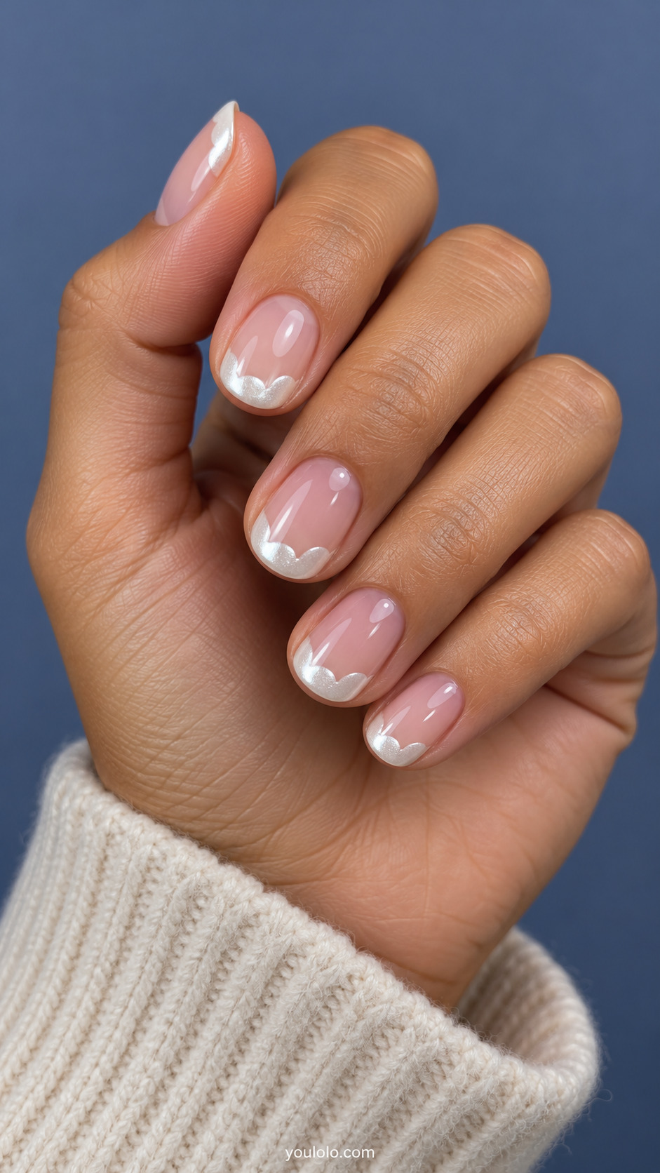 Sheer pink short ovals with shallow scalloped pearl-white chrome French tips.