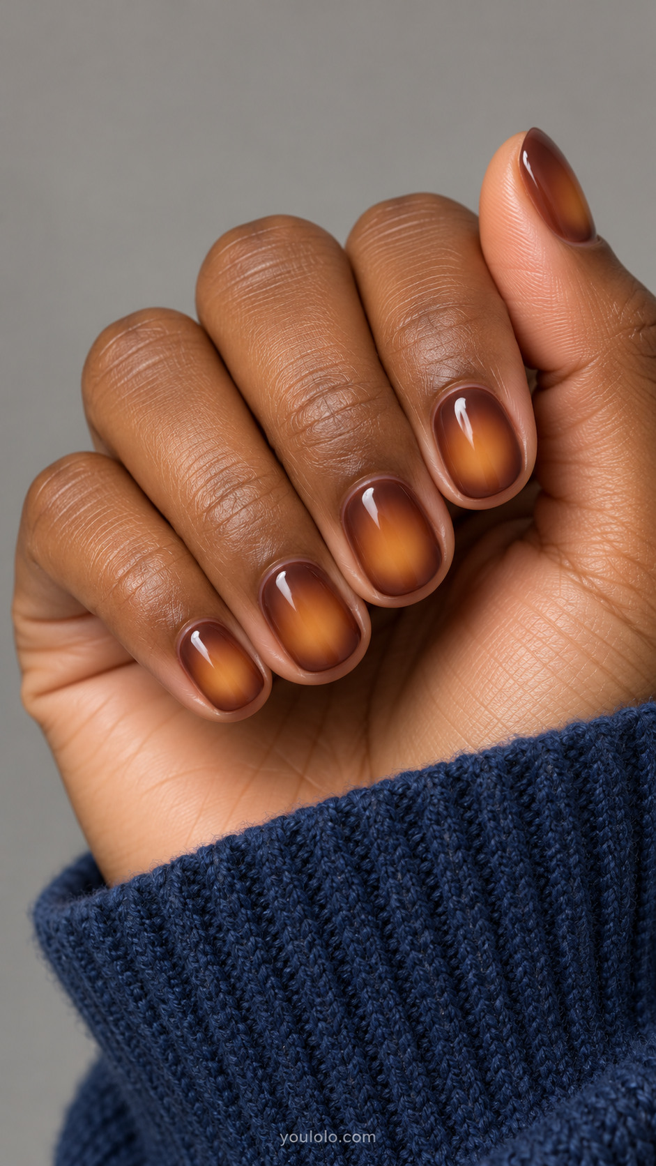 Short brown nails with diffused amber centers