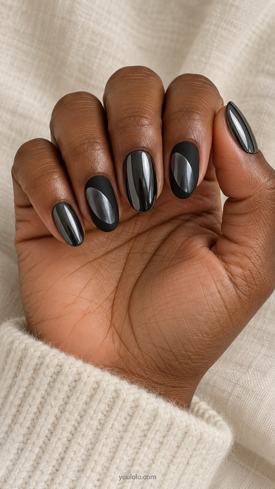 Medium oval coordinated set: thumb middle pinky full dark gunmetal mirror chrome, index and ring matte-black with one broad flat dark chrome off-center rounded lozenge