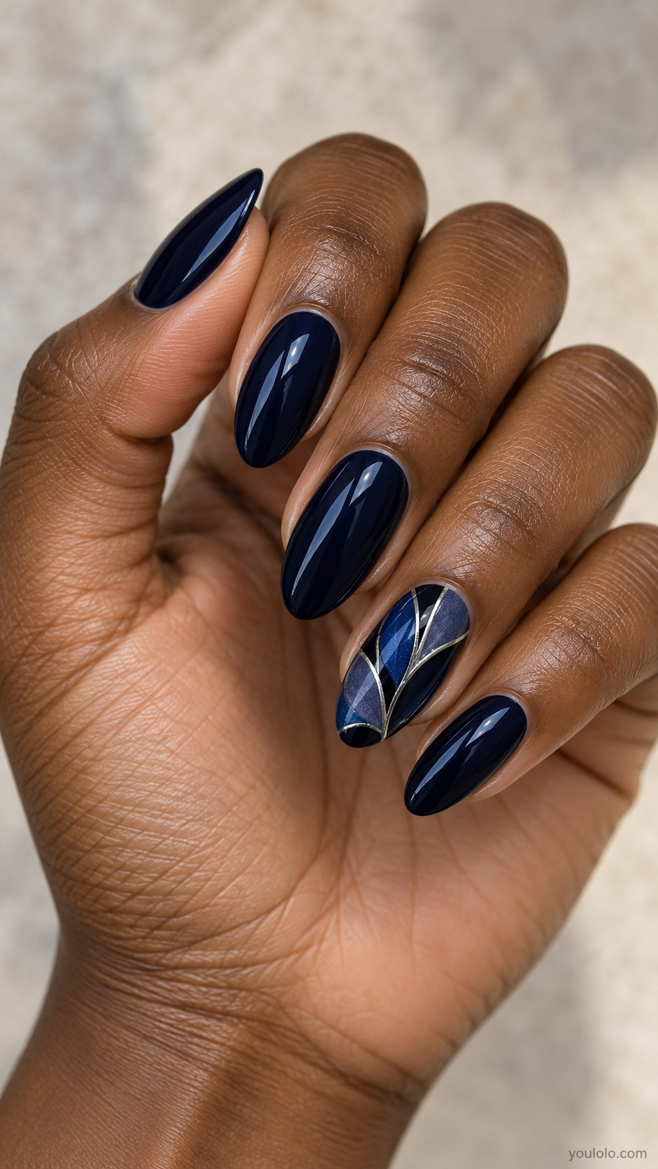 Midnight Blue Stained-Glass Petals on a naturally posed hand, showing dark blue polish and detailed nail art