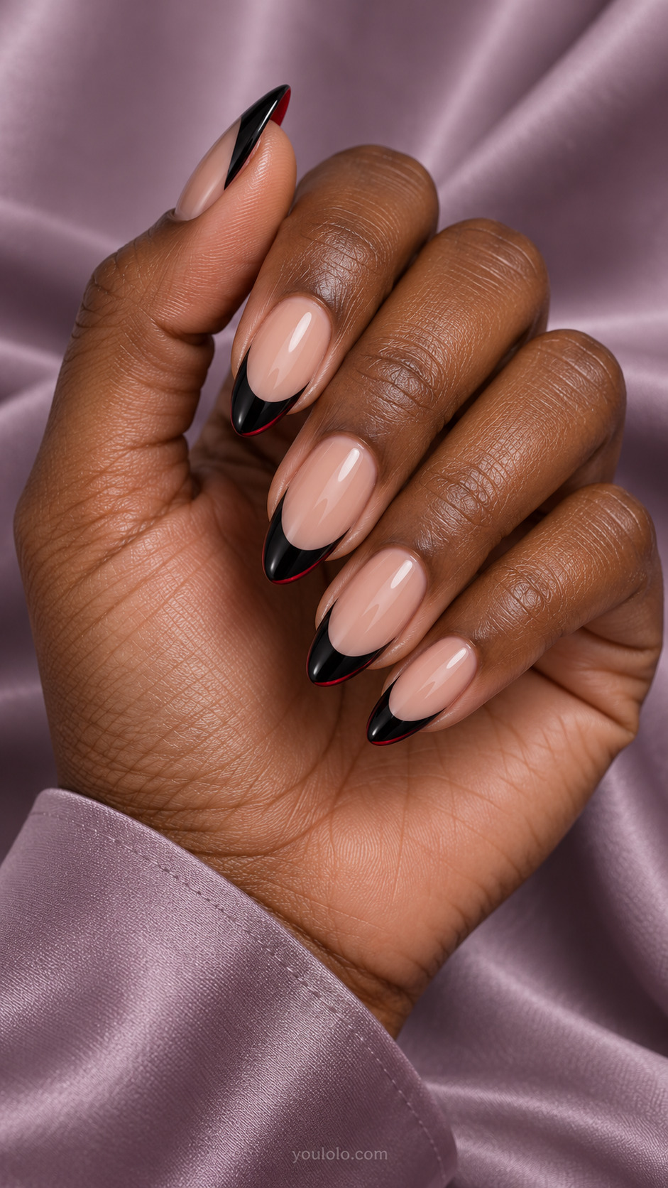 Black French with Red Undersides on almond nails with a nude base