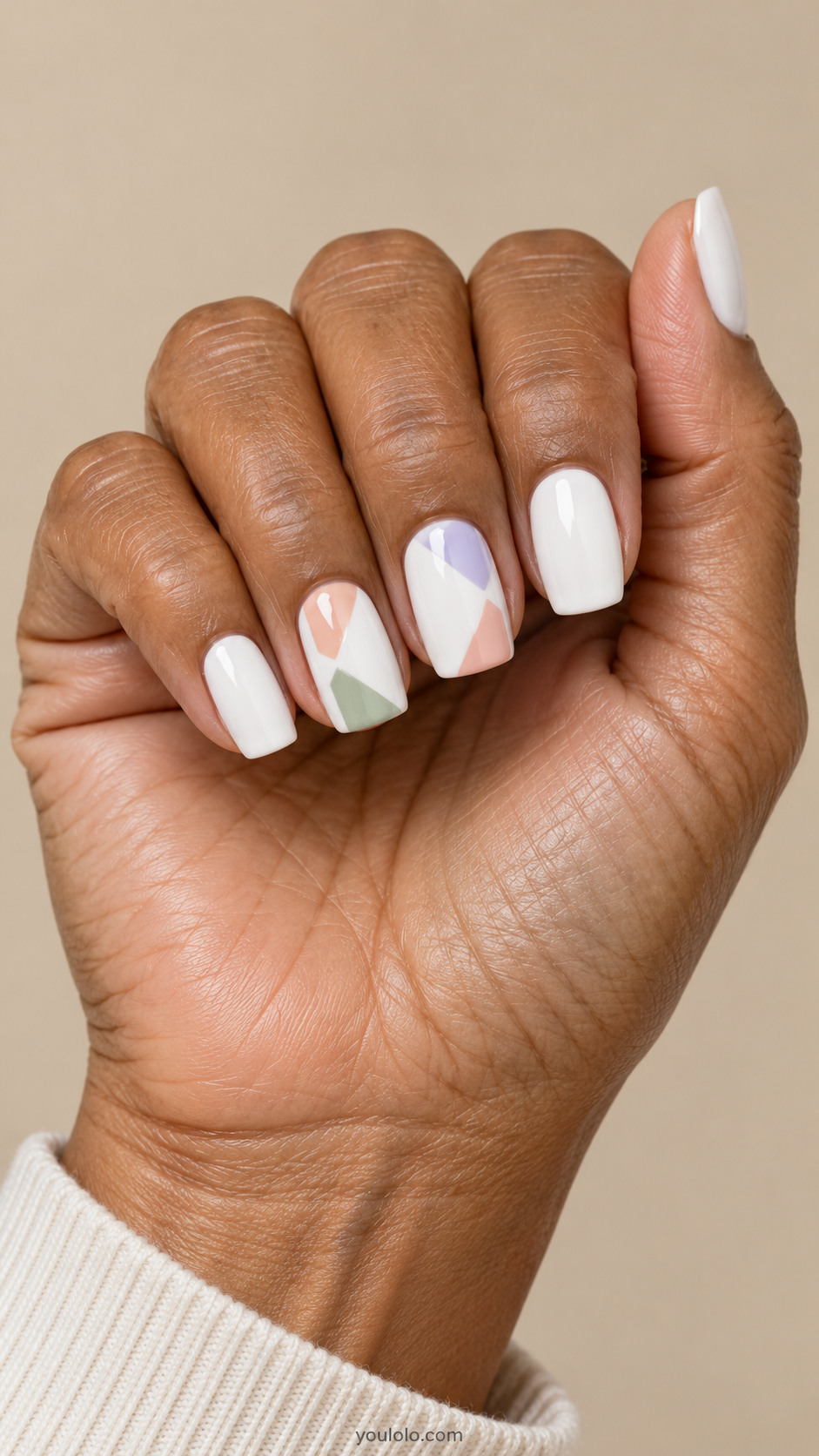 White square nails with peach sage and lavender polygons on two accent nails
