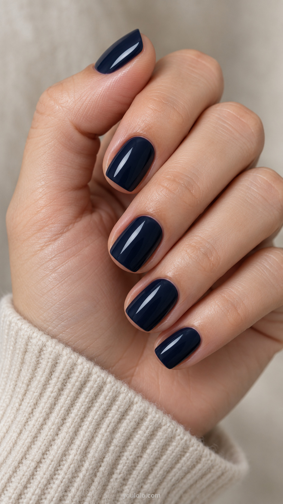 Short soft square nails with a glossy inky navy manicure.