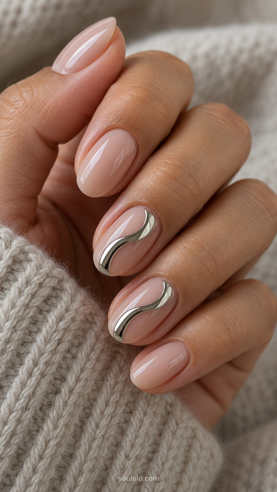 A Molten Silver Wave on Nude on a naturally gathered feminine hand showing the nail finish