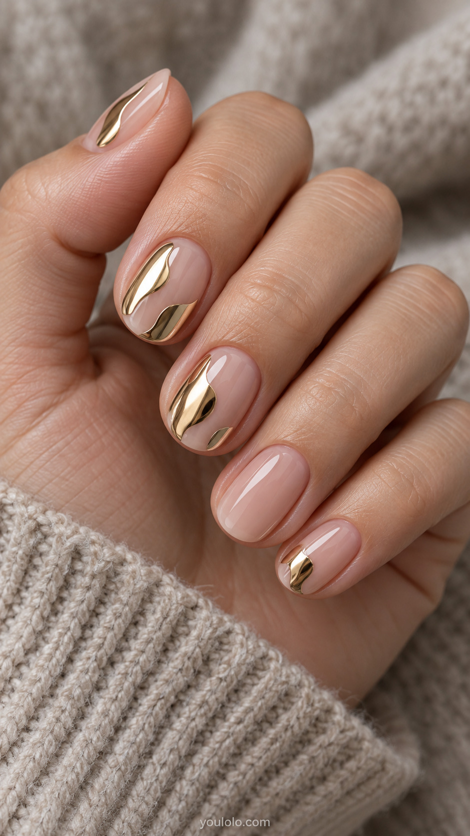 Gold Chrome Islands in Negative Space on a naturally gathered feminine hand showing the nail finish