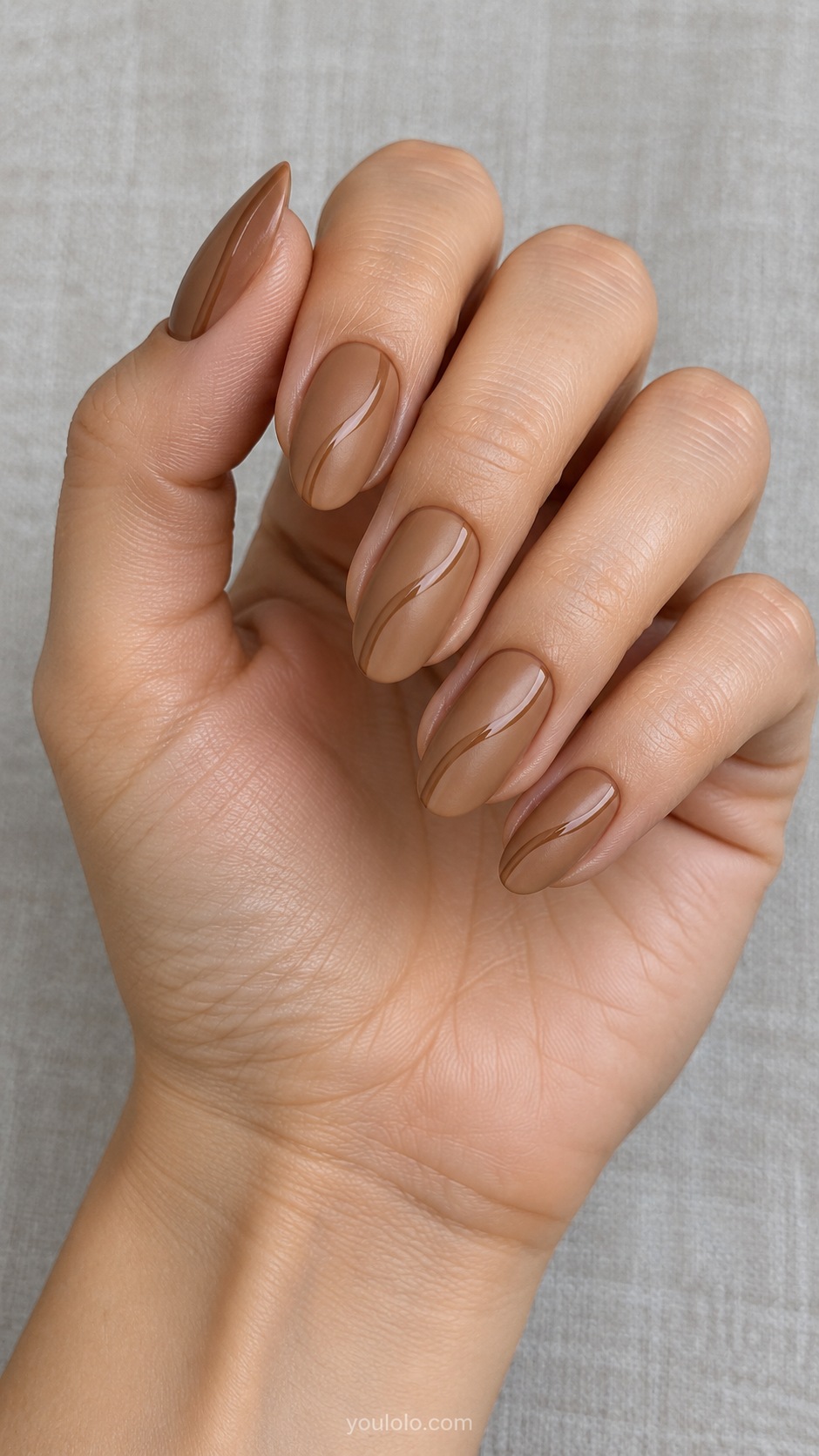 Caramel Satin Ribbon — medium almond warm caramel satin matte base one thin glossy caramel curved stripe on each nail same color different texture