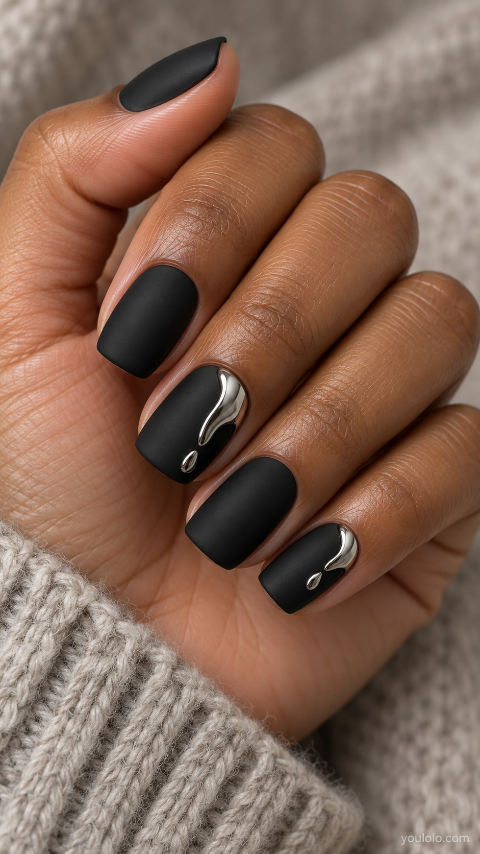 Matte Black with Silver Chrome Drops on a naturally gathered feminine hand showing the nail finish