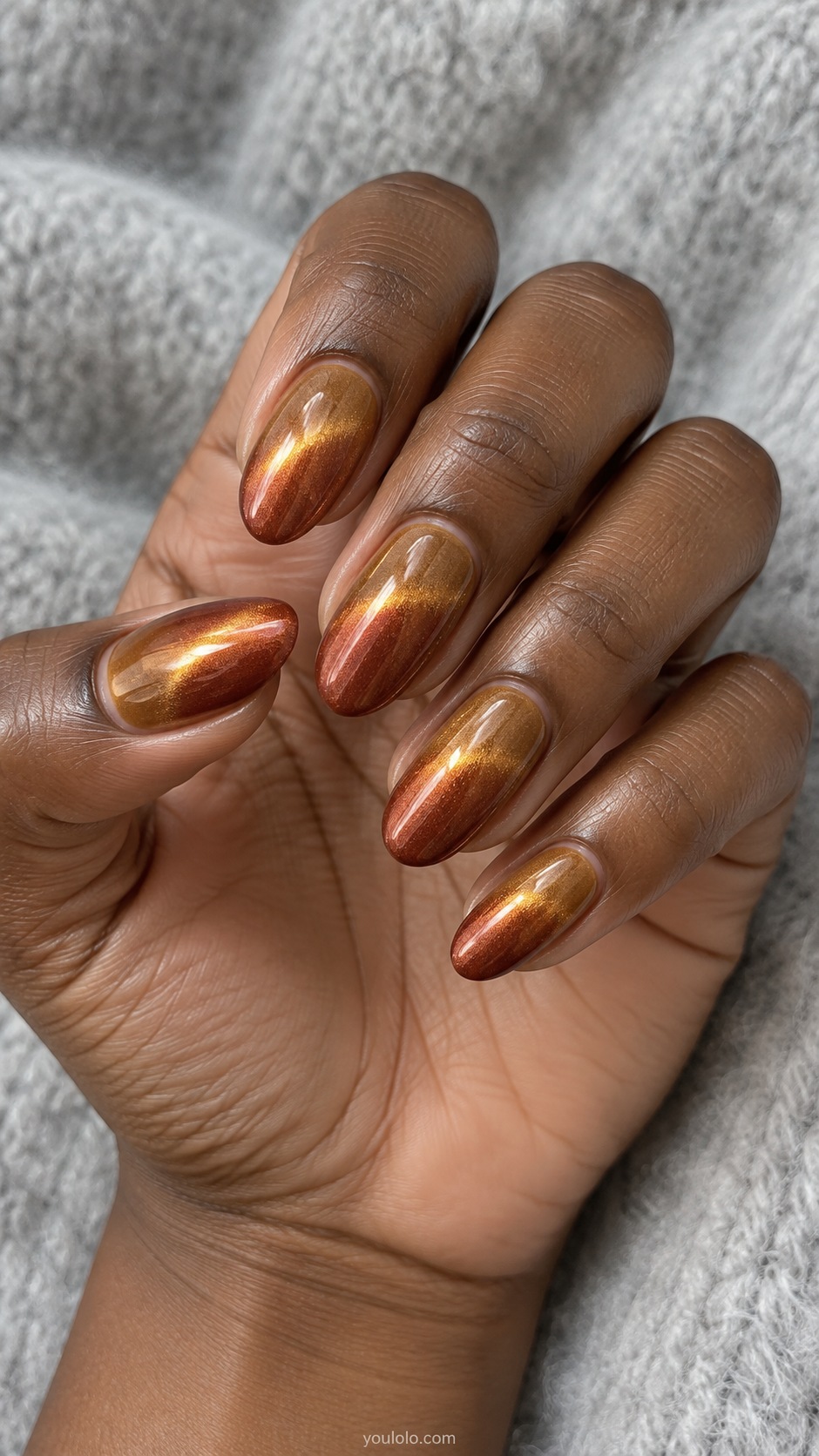 Copper Sunset Ombré cat eye nails — Medium almond magnetic ombre from amber near cuticle to rusty copper tips with broad golden reflective sheen.