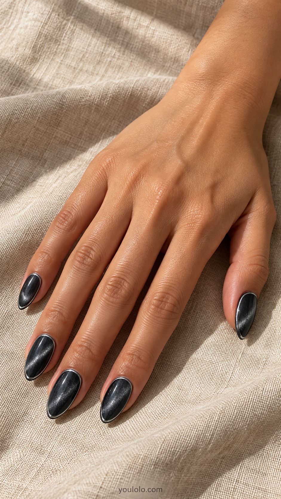Charcoal Cat Eye in a Silver Frame cat eye nails — Medium almond charcoal magnetic nails with slender hand painted silver perimeter outline, smooth flat surface no bulky jewelry.